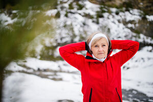 senior-woman-jogging-in-winter-nature-P5KYLNU.jpg  
